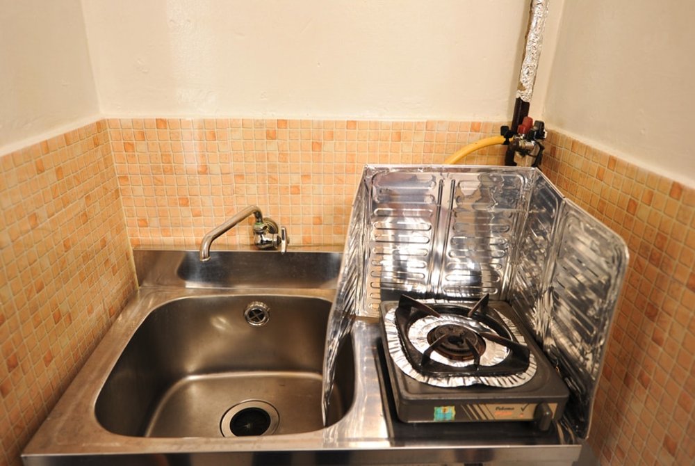 Each room has both water and gas. There is also a gas cooker.